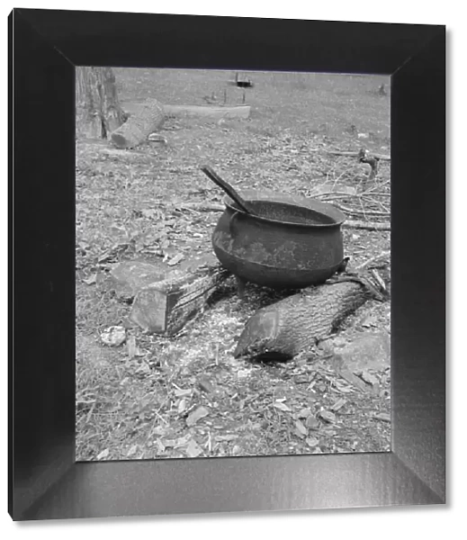 Iron pot for heating... in the yard of Negro tobacco farmer, Person County, North Carolina, 1939. Creator: Dorothea Lange