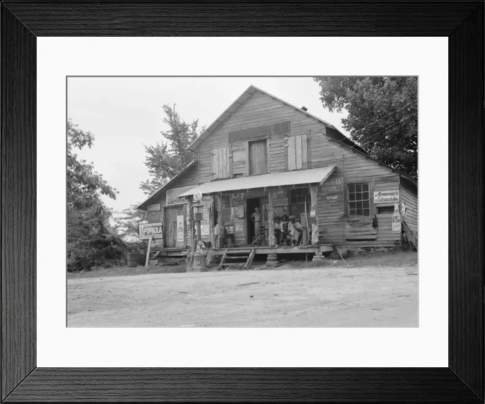Framed Print : Country store on dirt road, Sunday afternoon, near Gordenton, North Carolina, 1939. Creator: Dorothea Lange