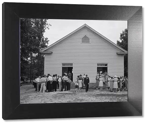 Congregation gathers in groups... Wheeleys Church, Person County, North Carolina, 1939. Creator: Dorothea Lange