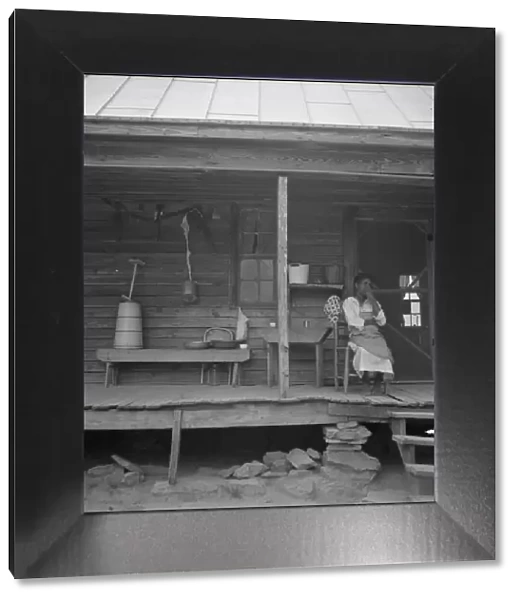 Porch of Negro tenant house, showing household equipment, Person County, North Carolina, 1939. Creator: Dorothea Lange