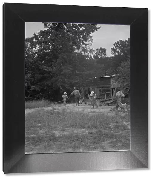Noontime chores on Negro tenant farm, Granville County, North Carolina, 1939. Creator: Dorothea Lange