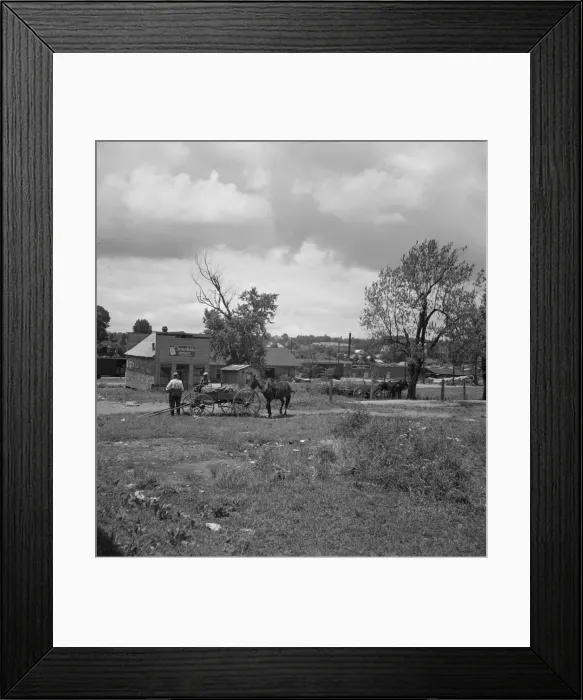 Framed Print : Wagons pulled up in field one block away from the main street, Siler City, North Carolina, 1939. Creator: Dorothea Lange Framed Print : Wagons pulled up in field one block away from the main street, Siler City, North Carolina, 1939. Creator: Dorothea Lange