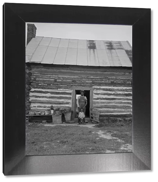Possibly: Young sharecropper and his first child, Hillside Farm, Person County, North Carolina, 1939 Creator: Dorothea Lange