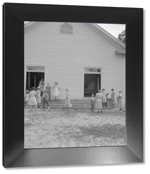 Possibly: Services are over, Wheeleys Church, Gordonton, Person County, North Carolina, 1939. Creator: Dorothea Lange