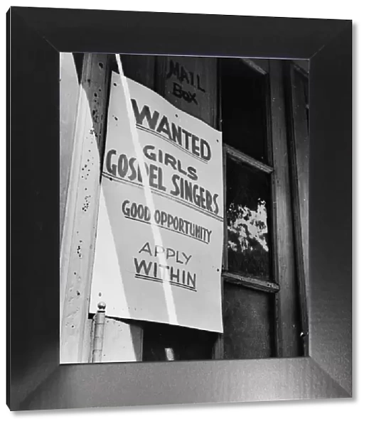 A sign in the Harlem section, New York, 1943. Creator: Gordon Parks