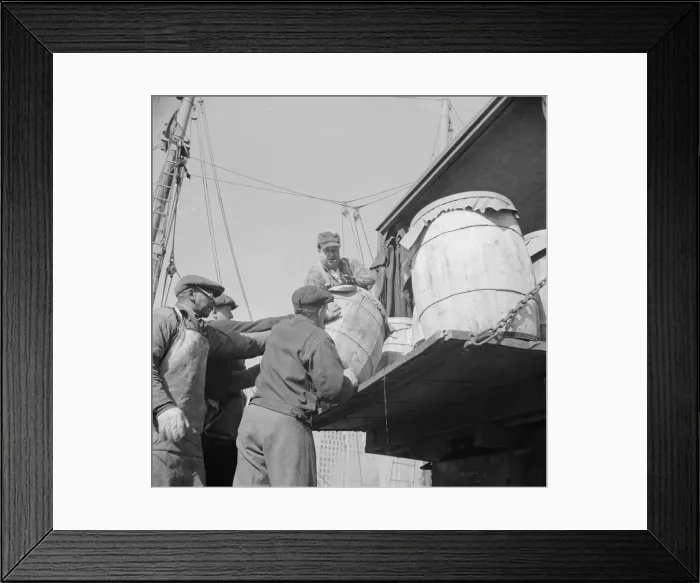 Framed Print : Dock worker at the Fulton fish market loading fish that have been caught... New York, 1943. Creator: Gordon Parks Framed Print : Dock worker at the Fulton fish market loading fish that have been caught... New York, 1943. Creator: Gordon Parks