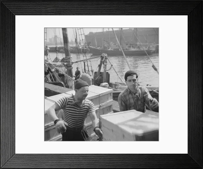 Framed Print : Possibly: Loaders placing fish that has been taken from boats, boxed, and iced... New York, 1943. Creator: Gordon Parks Framed Print : Possibly: Loaders placing fish that has been taken from boats, boxed, and iced... New York, 1943. Creator: Gordon Parks