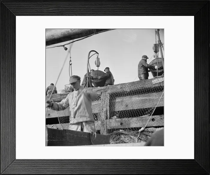 Framed Print : Dock stevedores at the Fulton fish market sending up baskets of fish... New York, 1943. Creator: Gordon Parks Framed Print : Dock stevedores at the Fulton fish market sending up baskets of fish... New York, 1943. Creator: Gordon Parks