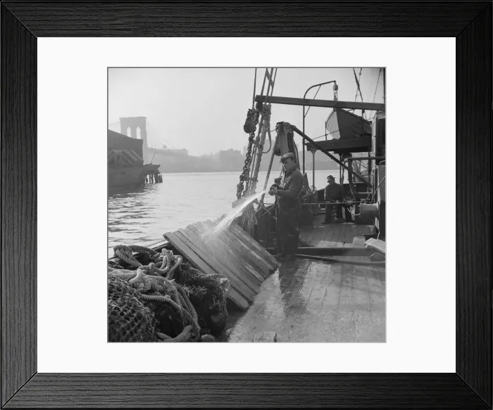 Framed Print : Fisherman washing off the slats used to hold fish during the trip down from New... New York, 1943. Creator: Gordon Parks Framed Print : Fisherman washing off the slats used to hold fish during the trip down from New... New York, 1943. Creator: Gordon Parks