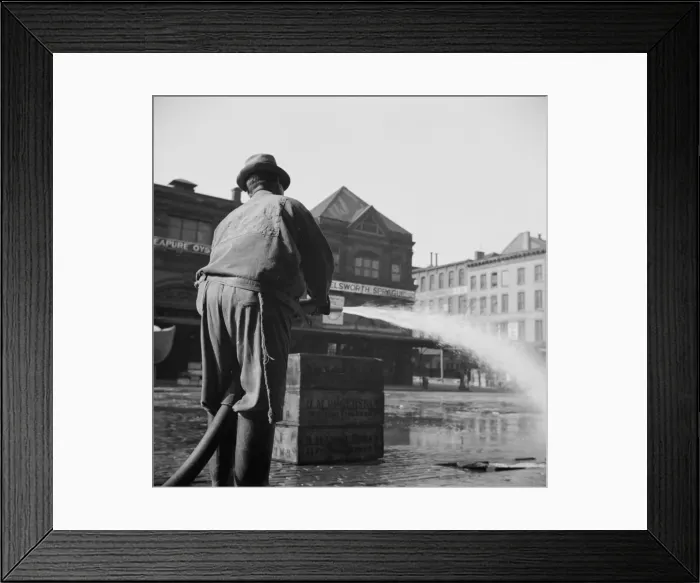 Framed Print : Workmen from the sanitary department flushing the street in front of the Fulton... New York, 1943. Creator: Gordon Parks Framed Print : Workmen from the sanitary department flushing the street in front of the Fulton... New York, 1943. Creator: Gordon Parks