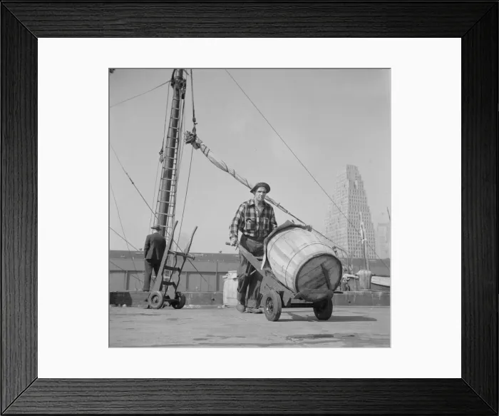 Framed Print : Dock stevedore at the Fulton fish market moving a barrel of codfish, New York, 1943. Creator: Gordon Parks Framed Print : Dock stevedore at the Fulton fish market moving a barrel of codfish, New York, 1943. Creator: Gordon Parks