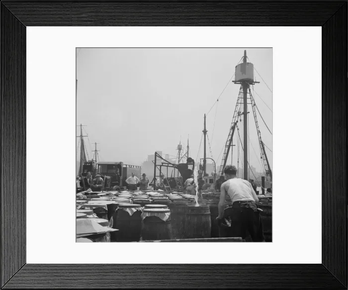 Framed Print : Possibly: Watering fish at the Fulton fish market with brine water, New York, 1943. Creator: Gordon Parks Framed Print : Possibly: Watering fish at the Fulton fish market with brine water, New York, 1943. Creator: Gordon Parks