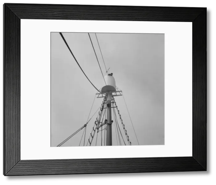 Framed Print : Possibly: Frank Mineo, owner of the Alden, climbs to the crow s... Gloucester, Massachusetts], 1943 Creator: Gordon Parks