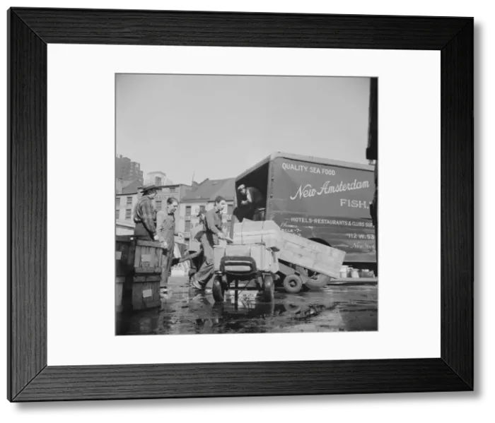 Framed Print : Loading boxes of fish to be shipped to hotels and restaurants at the Fulton fish... New York, 1943. Creator: Gordon Parks Framed Print : Loading boxes of fish to be shipped to hotels and restaurants at the Fulton fish... New York, 1943. Creator: Gordon Parks