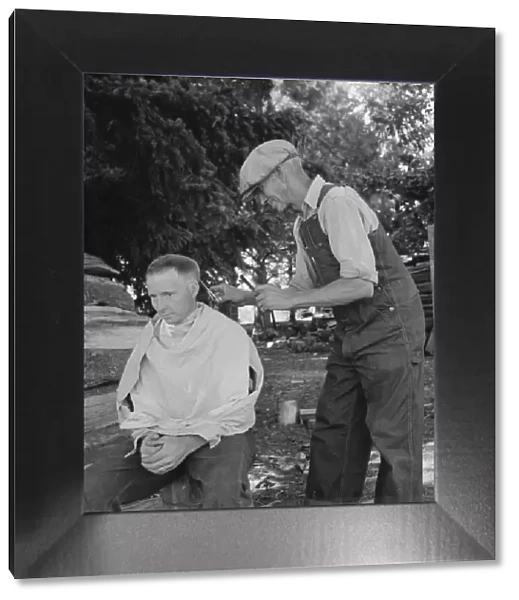 Bean pickers barber each other, near West Stayton, Marion County, Oregon, 1939. Creator: Dorothea Lange