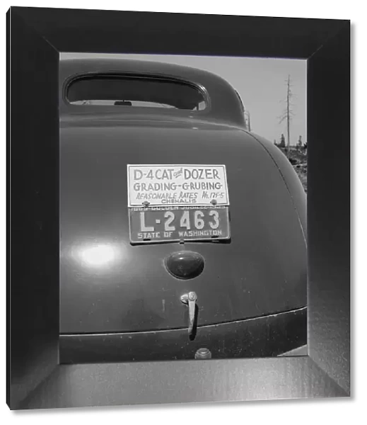 Bulldozer contractors car, near Vader, Lewis County, Western Washington, 1939. Creator: Dorothea Lange