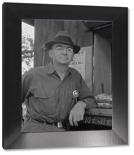 Deputy sheriff, stationed at paymasters window... near Grants Pass, Josephine County, Oregon, 1939 Creator: Dorothea Lange