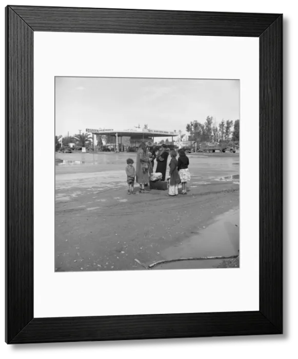 Framed Print : Family of homeless, walking people are left at the edge of the next town, 1939. Creator: Dorothea Lange Framed Print : Family of homeless, walking people are left at the edge of the next town, 1939. Creator: Dorothea Lange