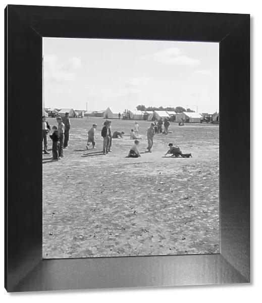 Marble time in FSA migratory labor camp, near Calipatria, Imperial Valley, CA, 1939. Creator: Dorothea Lange