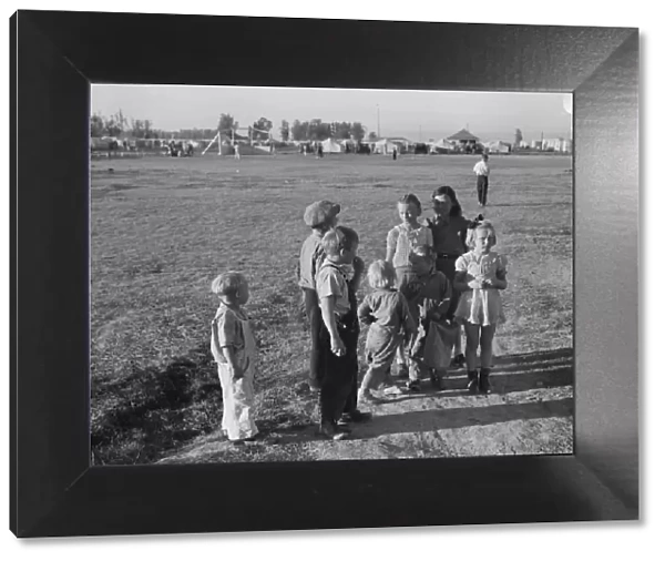 Children of migratory pea pickers in Brawley camp, California, 1939. Creator: Dorothea Lange