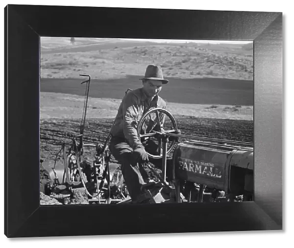 Young Idaho farmer plowing... Ola self-help sawmill co-op... Gem County, Idaho, 1939. Creator: Dorothea Lange