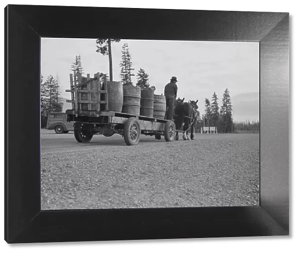 Farmer and his boy hauling water for drinking and domestic purposes... Boundary County, Idaho, 1939 Creator: Dorothea Lange