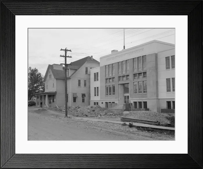 Framed Print : The new WPA courthouse alongside the old county courthouse, Bonners Ferry, Idaho, 1939. Creator: Dorothea Lange Framed Print : The new WPA courthouse alongside the old county courthouse, Bonners Ferry, Idaho, 1939. Creator: Dorothea Lange