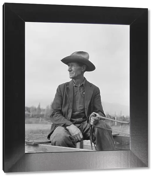 Ex-Nebraska farmer now developing farm out of the stumps, Bonner County, Idaho, 1939. Creator: Dorothea Lange