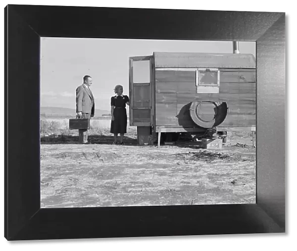 The camp nurse introduces doctor to mother of sick baby, Merrill, Klamath County, Oregon, 1939. Creator: Dorothea Lange