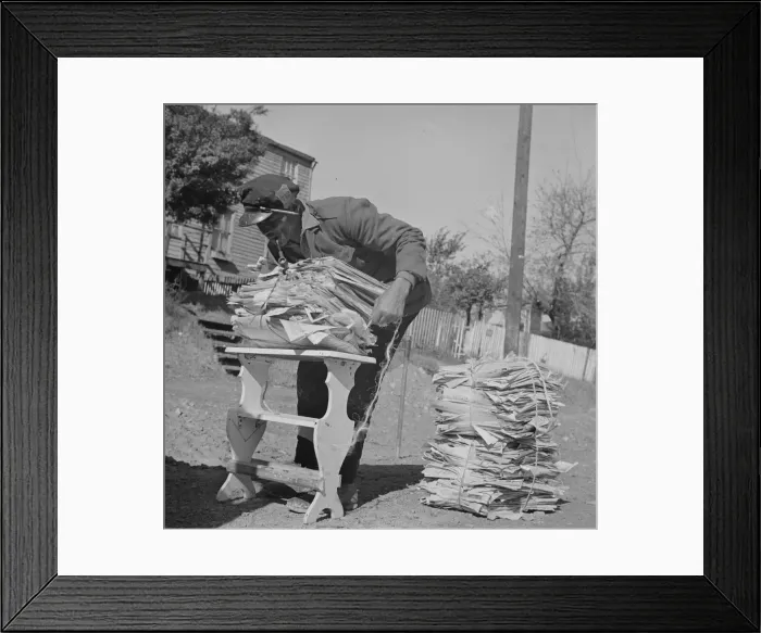 Framed Print : Mr. Venus Alsobrook, official salvage collector for the government wrapping... Washington, DC, 1942 Creator: Gordon Parks Framed Print : Mr. Venus Alsobrook, official salvage collector for the government wrapping... Washington, DC, 1942 Creator: Gordon Parks