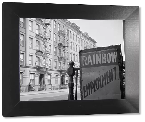 One of the numerous employment agency signs in the Harlem area, New York, 1943. Creator: Gordon Parks