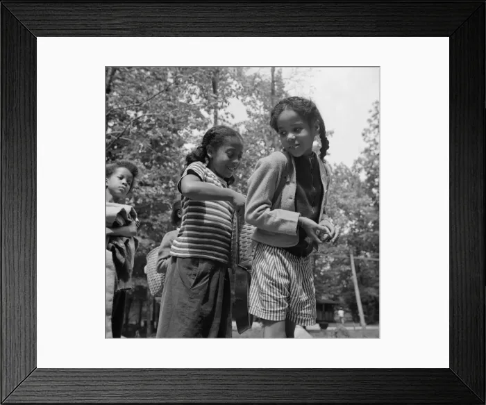 Framed Print : Girls adjusting each others packs for a hike at Camp Fern Rock, Bear Mountain, New York, 1943. Creator: Gordon Parks Framed Print : Girls adjusting each others packs for a hike at Camp Fern Rock, Bear Mountain, New York, 1943. Creator: Gordon Parks