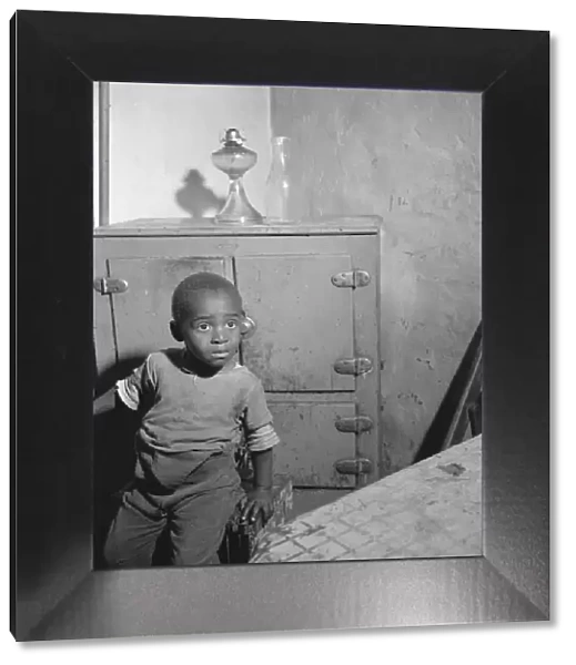 A young boy who lives near the nations capitol, Washington, D. C. 1942. Creator: Gordon Parks