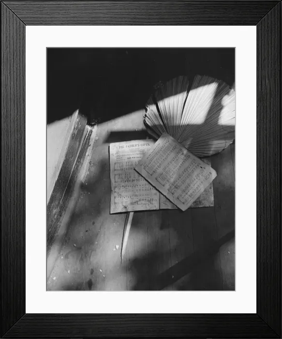Framed Print : Song sheets and a fan left behind in an abandoned church on Independence Ave, Washington, D. C, 1942. Creator: Gordon Parks Framed Print : Song sheets and a fan left behind in an abandoned church on Independence Ave, Washington, D. C, 1942. Creator: Gordon Parks