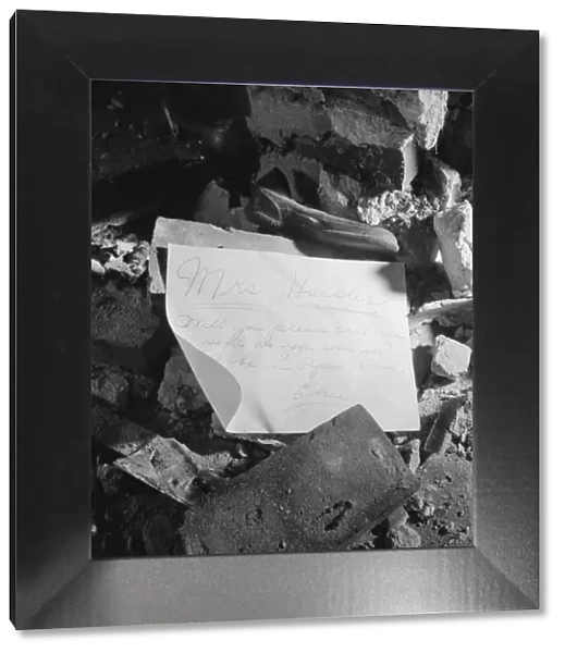 A note left in a wrecked house on Independence Avenue, Washington, D. C, 1942. Creator: Gordon Parks