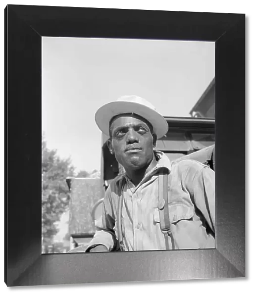 Laborer listening to instructions being given by a section foreman, Washington, D. C, 1942. Creator: Gordon Parks