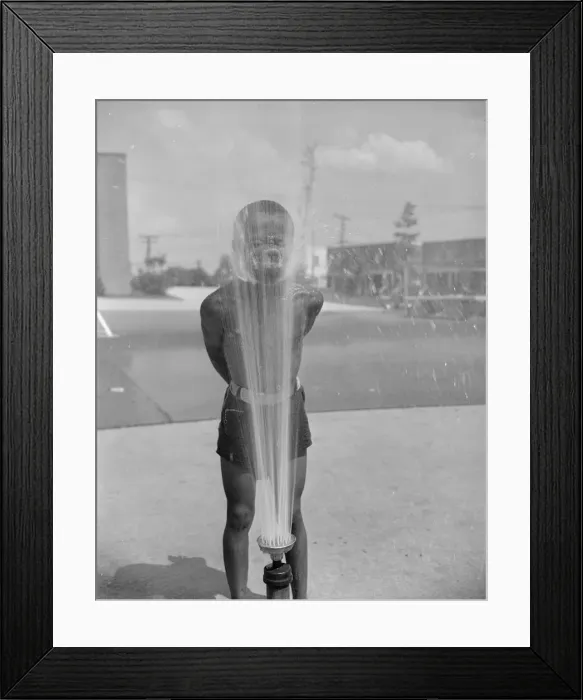 Framed Print : Playing in the community sprayer, Frederick Douglass housing project, Anacostia, D. C. 1942. Creator: Gordon Parks Framed Print : Playing in the community sprayer, Frederick Douglass housing project, Anacostia, D. C. 1942. Creator: Gordon Parks