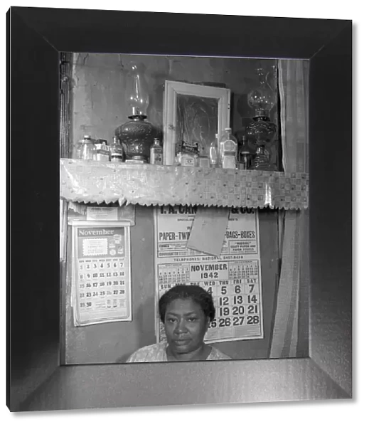 Negro woman in her home, Washington (southwest section), D. C. 1942. Creator: Gordon Parks