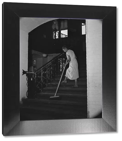 Government charwoman cleaning after regular working hours, Washington, D. C. 1942. Creator: Gordon Parks