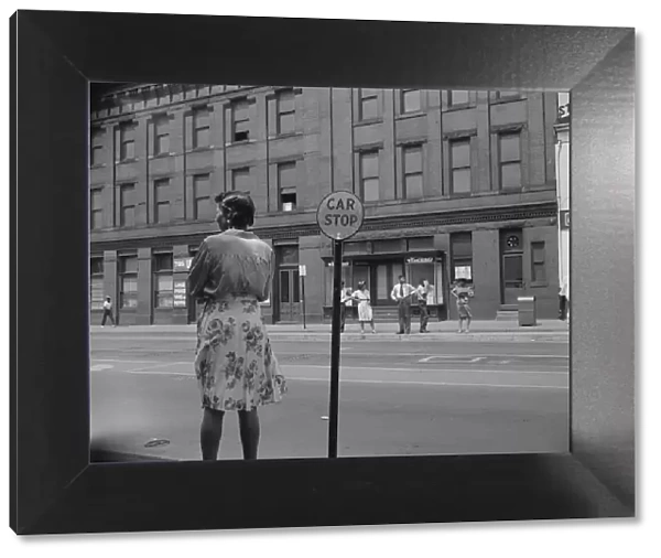 Waiting for the street car at 7th and Florida Avenue, N. W. Washington, D. C. 1942. Creator: Gordon Parks