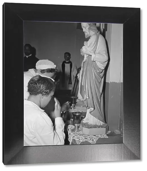 Worshippers before the altar in the St. Martins Spiritual Church, Washington, D. C. 1942. Creator: Gordon Parks