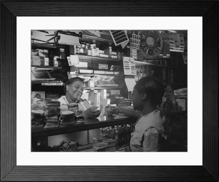 Framed Print : Clerk waiting on a customer in the store owned by Mr. J. Benjamin, Washington, D. C. 1942. Creator: Gordon Parks Framed Print : Clerk waiting on a customer in the store owned by Mr. J. Benjamin, Washington, D. C. 1942. Creator: Gordon Parks