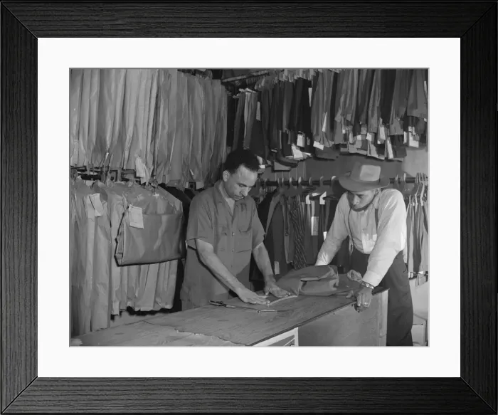 Framed Print : A tailor in Franks cleaning and pressing establishment altering... Washington, D.C. 1942. Creator: Gordon Parks Framed Print : A tailor in Franks cleaning and pressing establishment altering... Washington, D.C. 1942. Creator: Gordon Parks