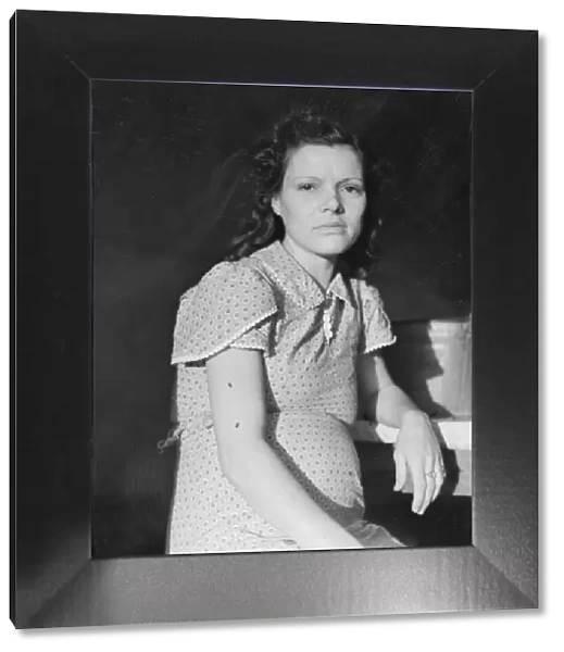 Daughter of migratory family in FSA labor camp, Calpatria, Imperial Valley, California, 1939. Creator: Dorothea Lange