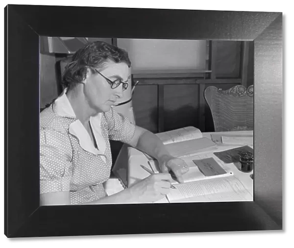 Wife of FSA borrower keeps account of loan of... Dead Ox Flat, Malheur County, Oregon, 1939. Creator: Dorothea Lange
