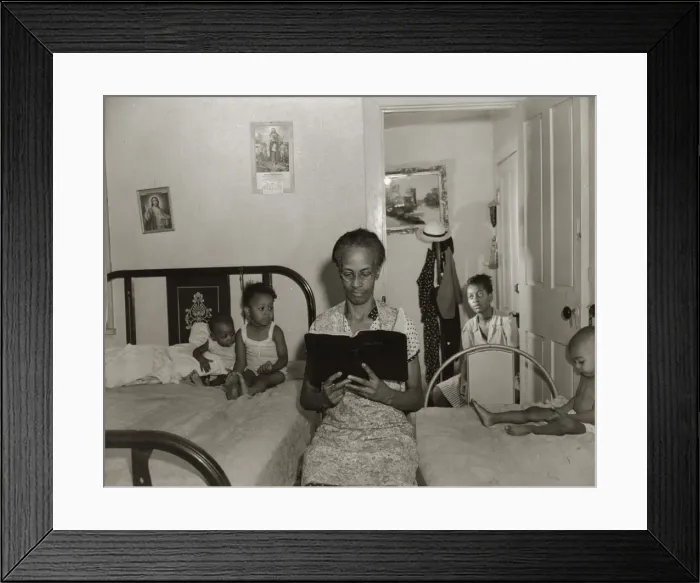 Framed Print : Mrs. Ella Watson, a government charwoman, reading the Bible to her household, Washington, DC, 1942. Creator: Gordon Parks