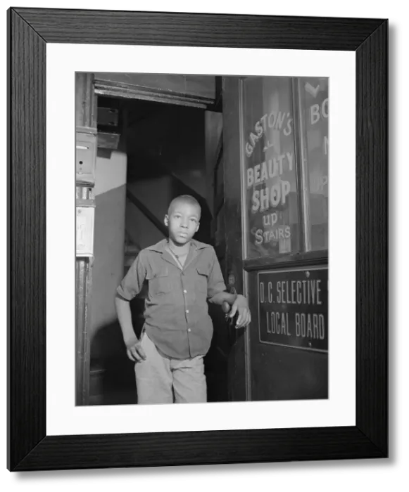 Framed Print : Youth waiting for a newspaper delivery truck, Washington, D. C. 1942. Creator: Gordon Parks Framed Print : Youth waiting for a newspaper delivery truck, Washington, D. C. 1942. Creator: Gordon Parks