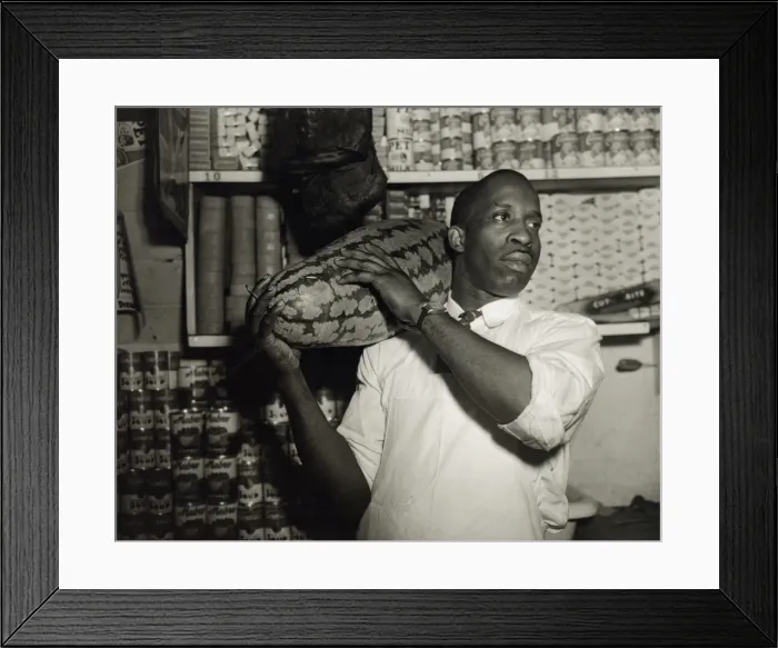 Framed Print : Mr. J. Benjamin, owner of the grocery store patronized by Mrs. Ella Watson... Washington, DC, 1942. Creator: Gordon Parks Framed Print : Mr. J. Benjamin, owner of the grocery store patronized by Mrs. Ella Watson... Washington, DC, 1942. Creator: Gordon Parks