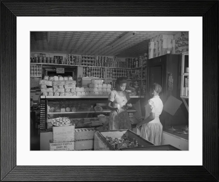 Framed Print : Mr. J. Benjamins daughter waiting on a customer in her fathers store, Washington, D. C. 1942. Creator: Gordon Parks Framed Print : Mr. J. Benjamins daughter waiting on a customer in her fathers store, Washington, D. C. 1942. Creator: Gordon Parks