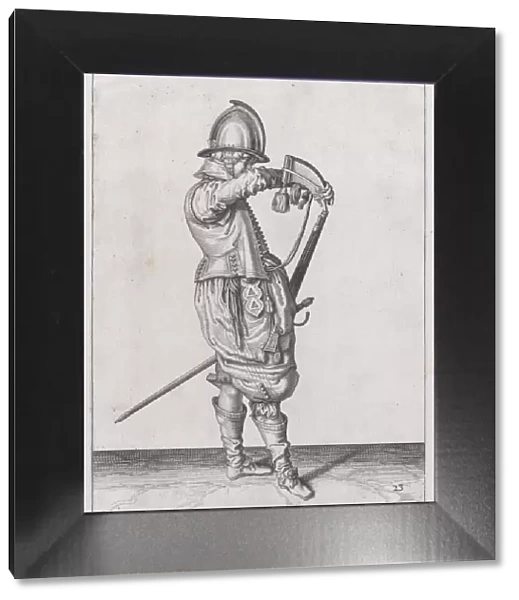 A soldier charging his caliver which is held stock down, from the Marksmen serie... published 1608. Creator: Robert Willemsz de Baudous
